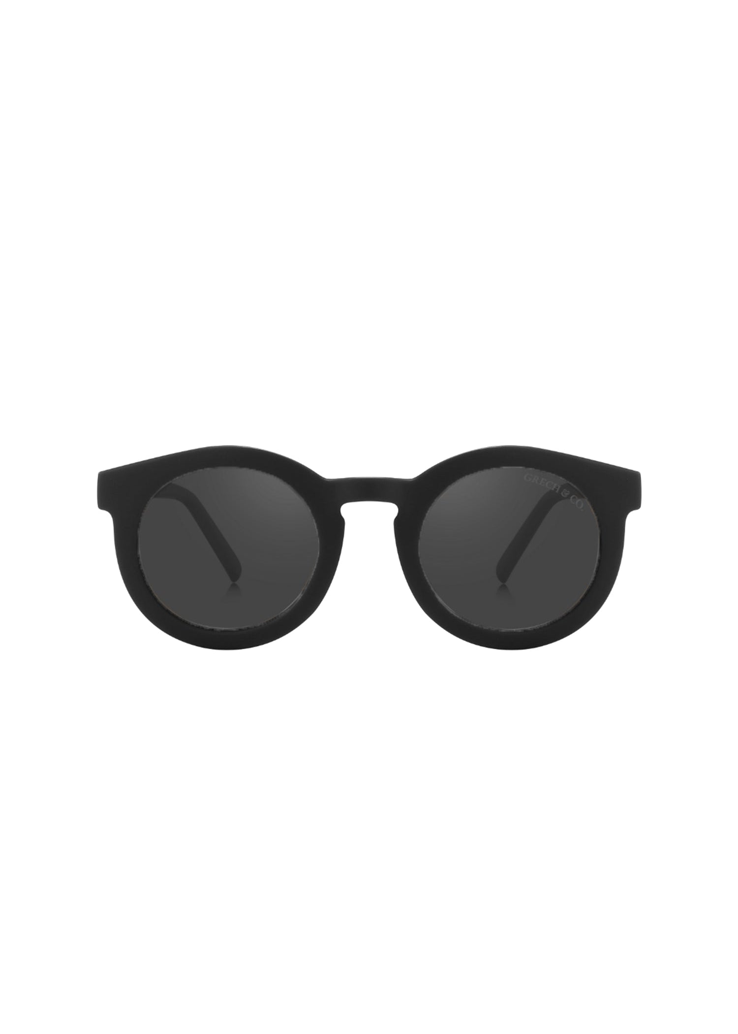 Child wearing biodegradable black sunglasses with polarized lenses and bendable TPE frame