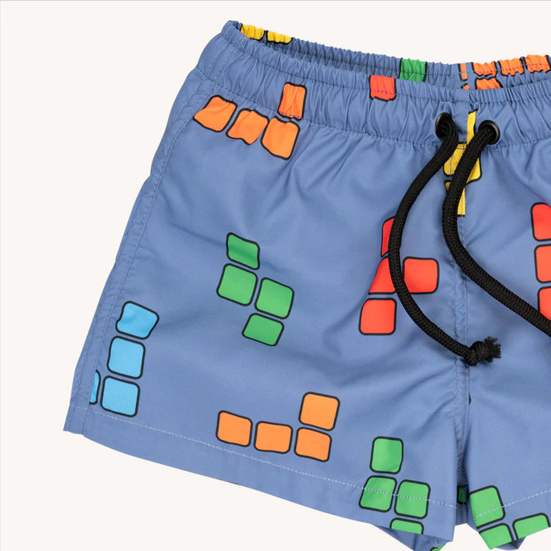 Boys swim trunks with a blue base and BLOX print - elastic waistband. There boys swim trunks are made with 100% recycled polyester, bets kids swimwear.