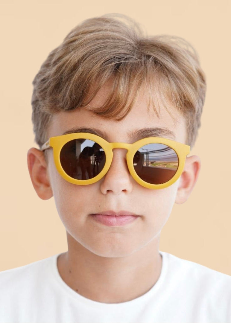 Sustainable kids sunglasses in yellow by Grech & Co with polarised lenses & UV400 protection. MiliMilu offers sunglasses for kids & Mini me matching sunglasses.