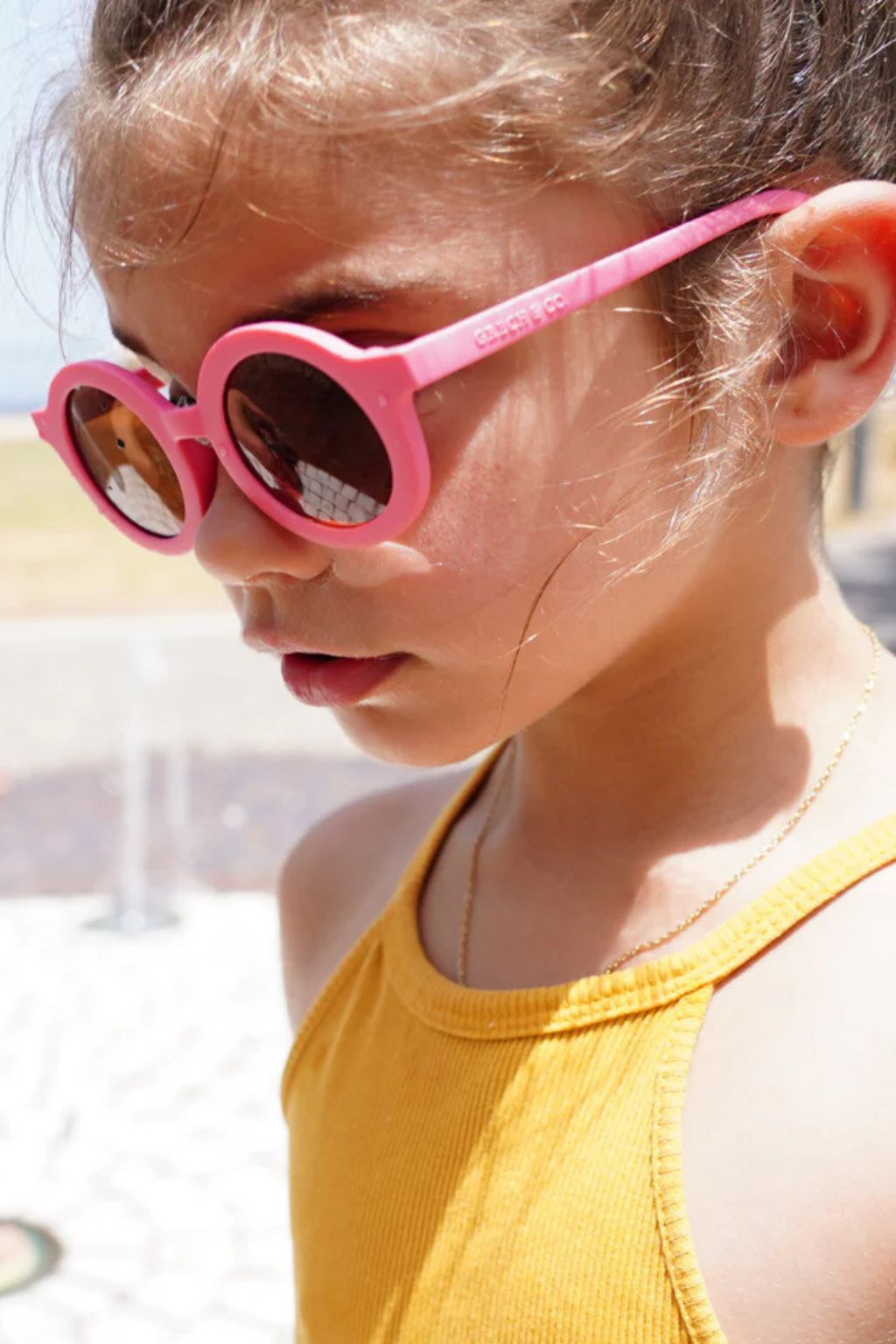 Sustainable kids sunglasses in bright pink by Grech & Co are made from eco-friendly break-resistant material - offering higher durability & longevity.