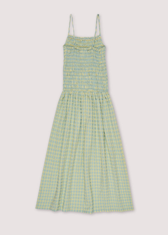 Shop Canyon women's summer maxi dress, which is one of the trendiest summer dresses and the perfect addition to your capsule wardrobe. The checked women's summer dress is designed with straps, pockets, and smock top. The most stylish summer dress you will have this summer. Shop best women summer fashion online.