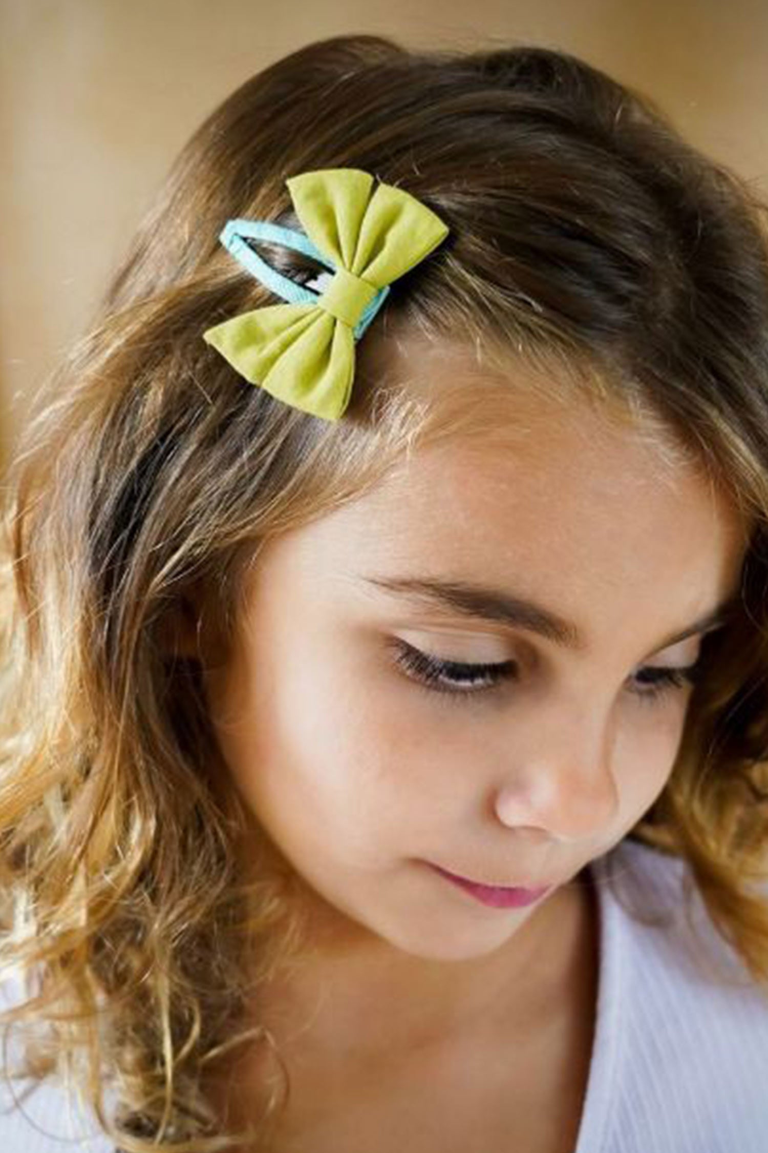 Beautiful bow hair clips in blue and green colour, snap clip is very gentle to the hair with a strong grip by Grech & Co. Shop online bow hairclips for girls.