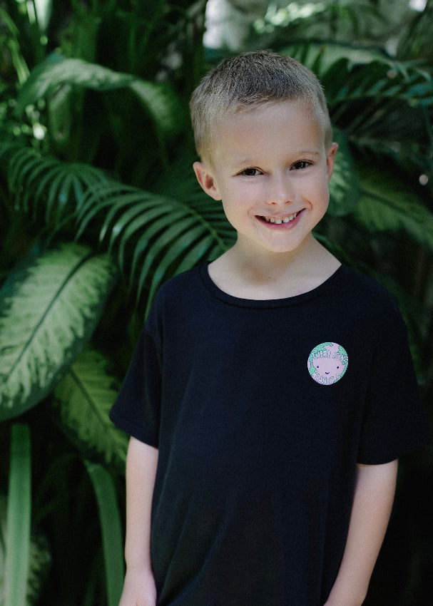 Kids wearing black bamboo t-shirt with environmental message from MiliMilu.