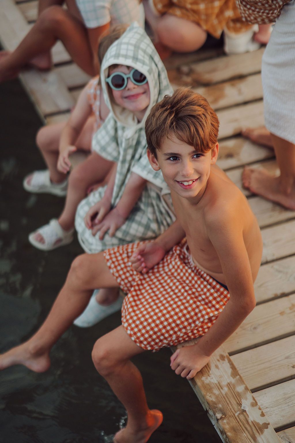 GRECH & CO boys swim trunks in Sienna Gingham pattern UPF 50 sustainable swimwear with adjustable waistband