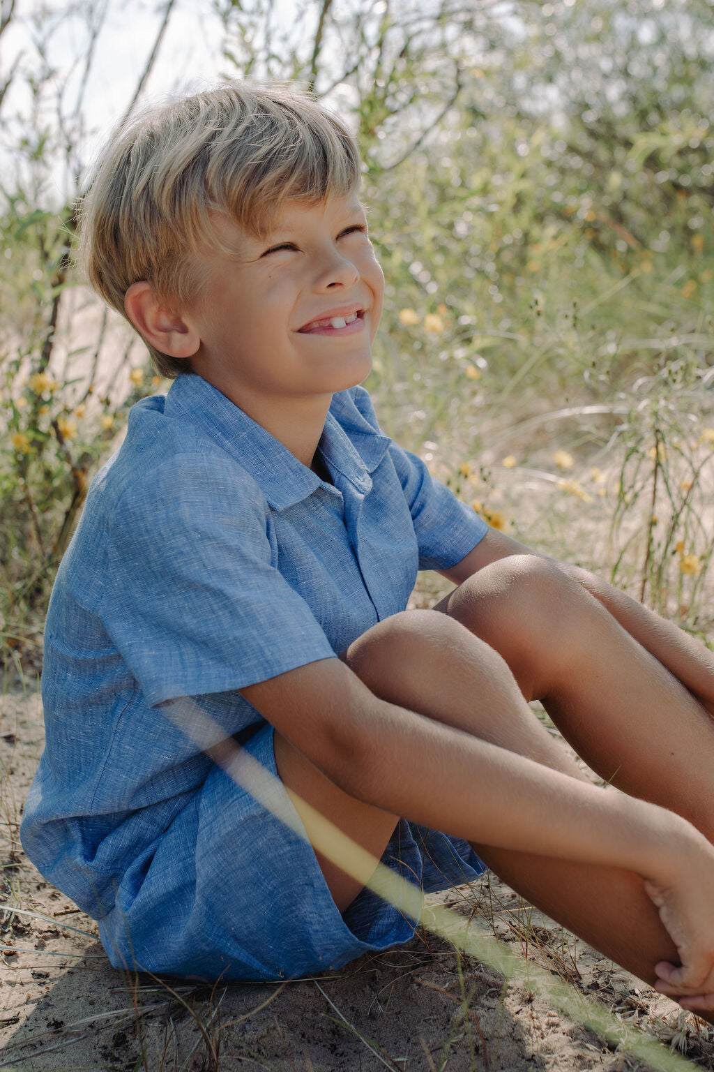 Boys blue linen summer outfit - shirt and shorts combination for complete coordinated look.