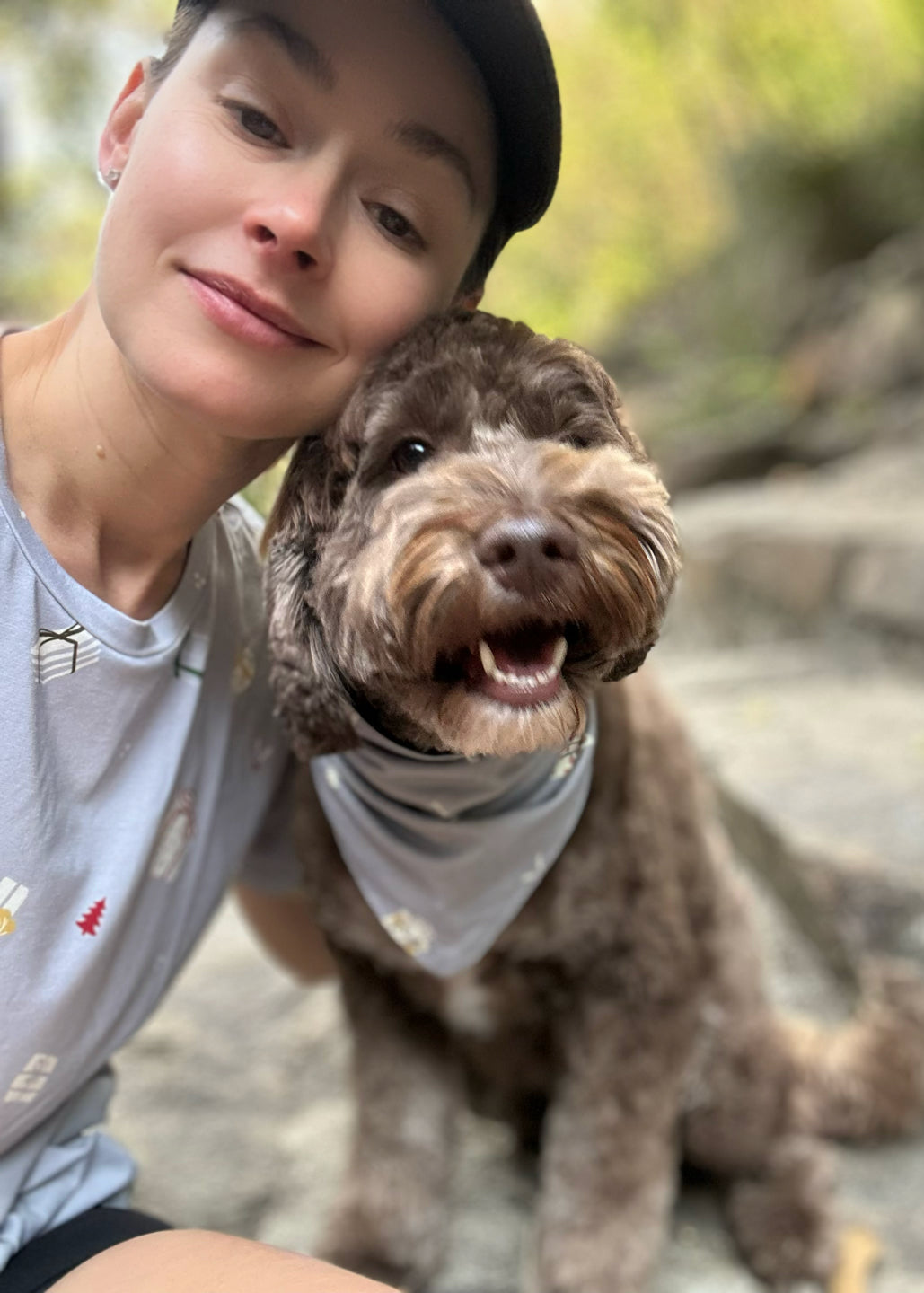 Dog wearing Christmas bandana matching with family holiday outfits