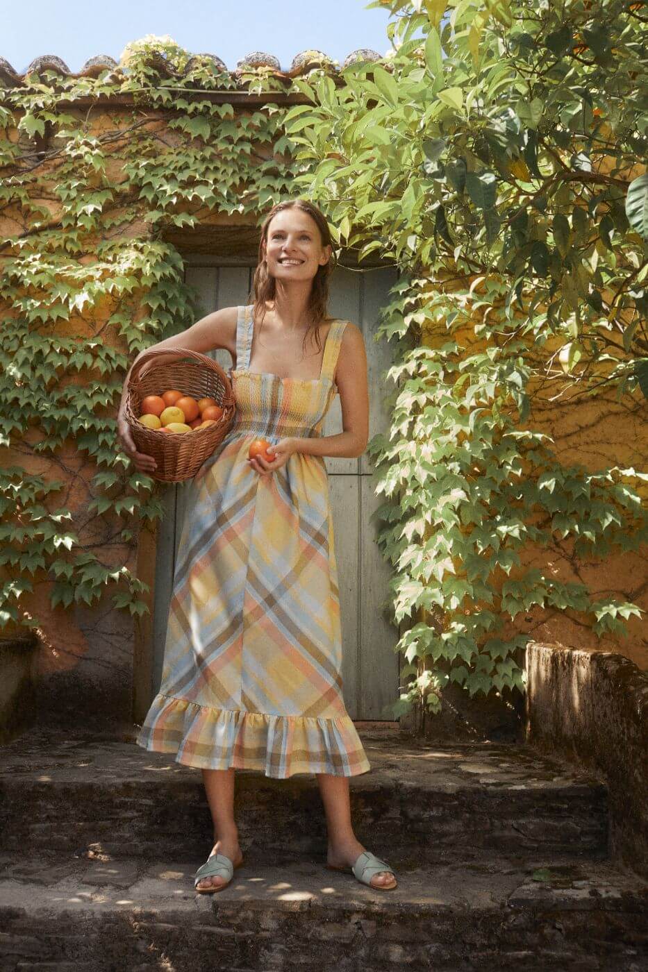 Breathable and lightweight organic cotton women summer dress is a flowy and feminine midi dress in checkered by The New Society. Sustainable women fashion.