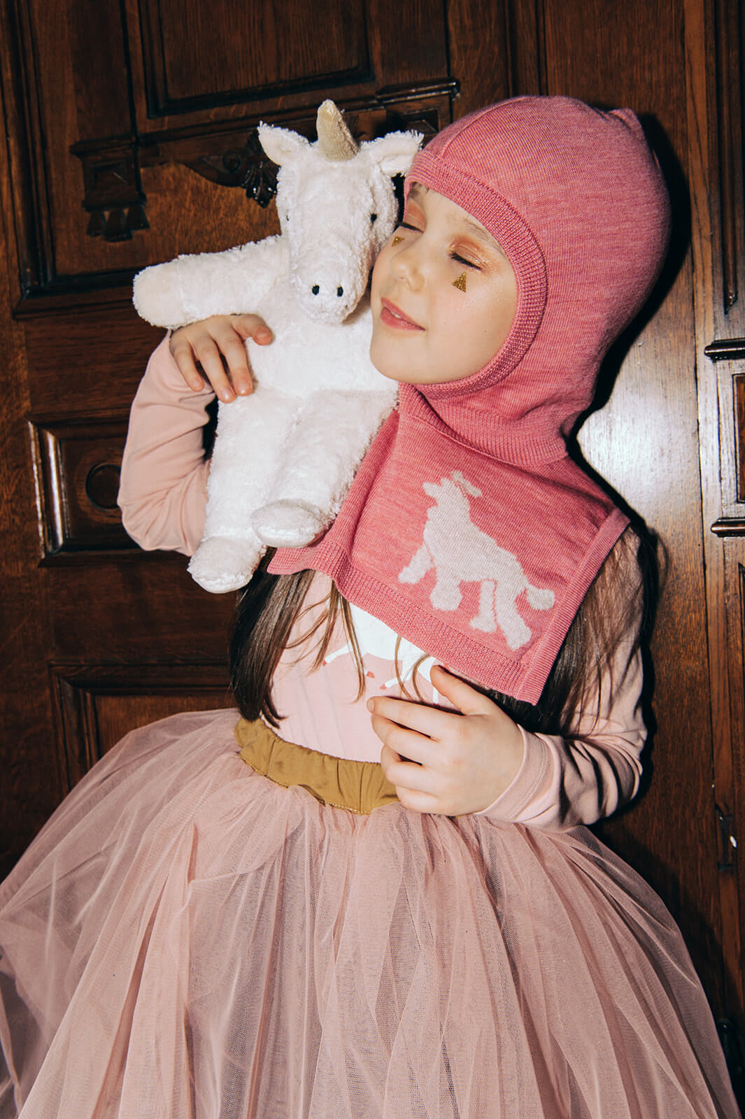 Shop pink girl's balaclava from merino wool online. This is an essential winter accessory to keep your child warm in colder weather and perfect for skiing.