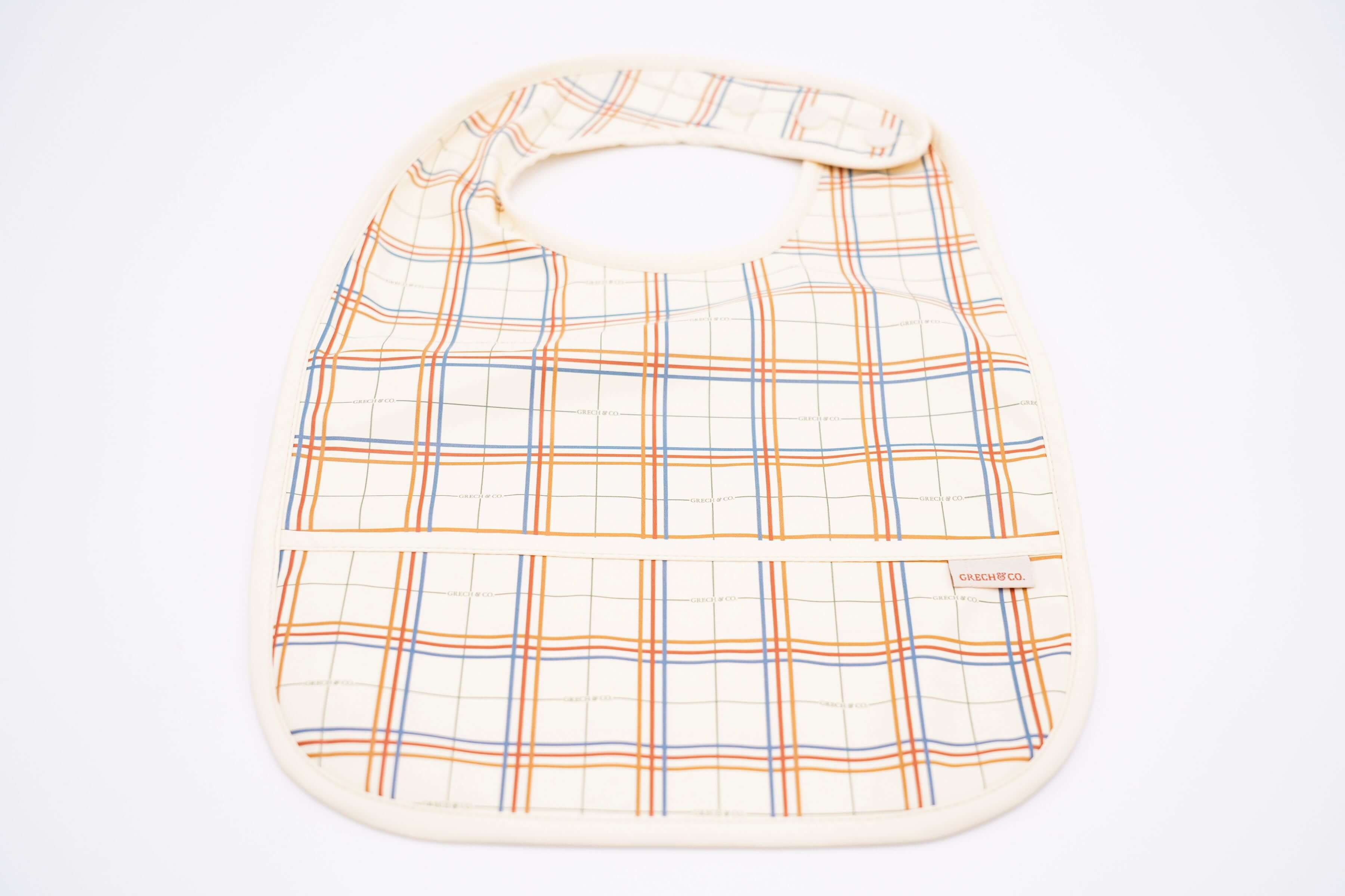 Baby bib online in Hong Kong and Singapore from eco-friendly and sustainable materials. Keep mealtimes cleaner and fun for all with the Grech & Co. easy-to-clean and store plaid baby bib, water-resistant recycled Oeko tex material. Stylish and practical baby and kids' bib for everyday use and best bib for travelling.