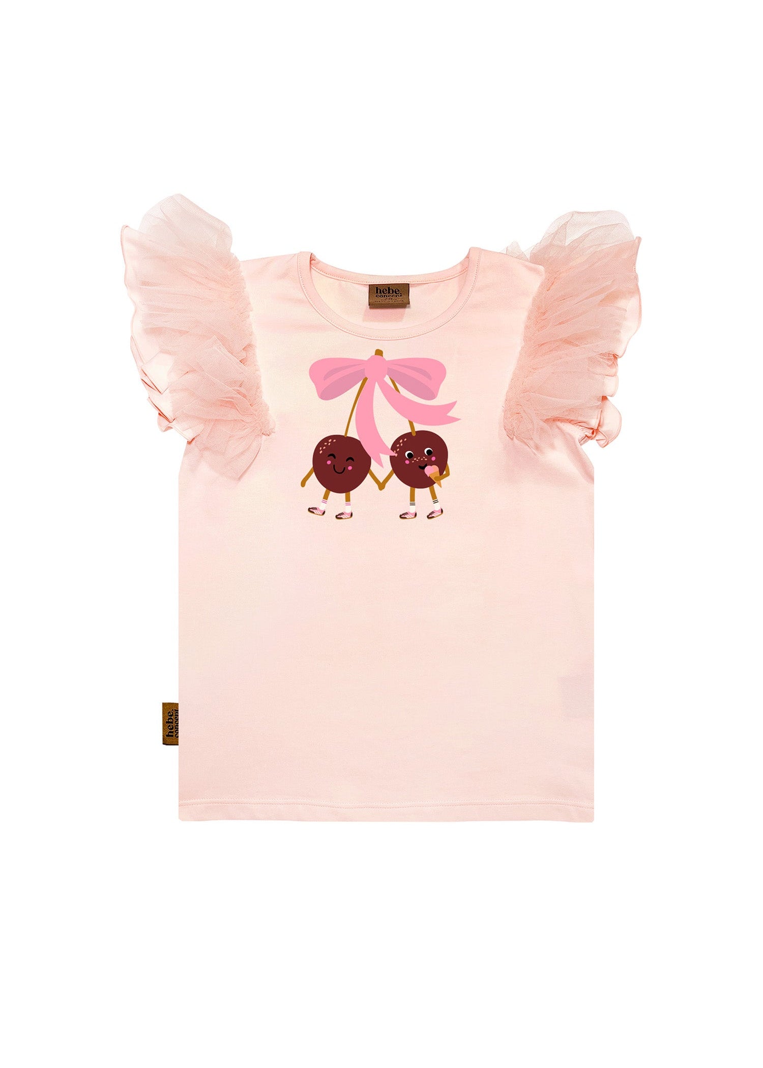 Girl wearing pink cherry print top with fluttery tulle sleeves, sustainable kids clothing