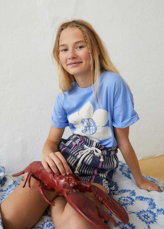 Girl wearing Echo organic cotton shorts by The New Society — stylish sustainable summer shorts for tweens | MiliMilu
