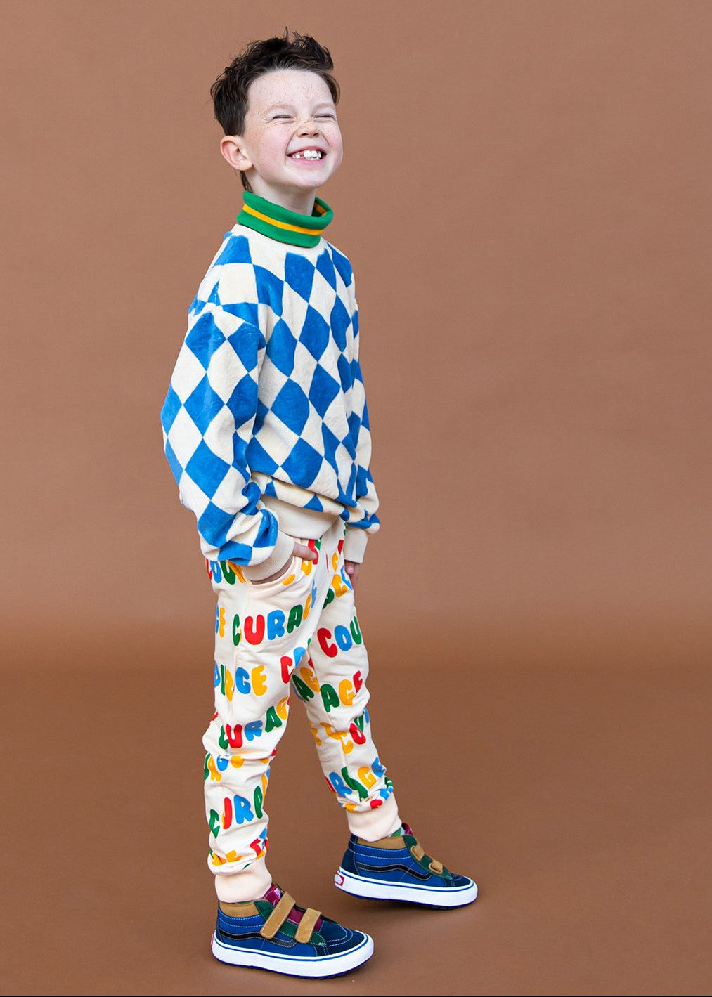 Kids organic cotton sweatpants with colourful Courage print — front view showing elastic waistband