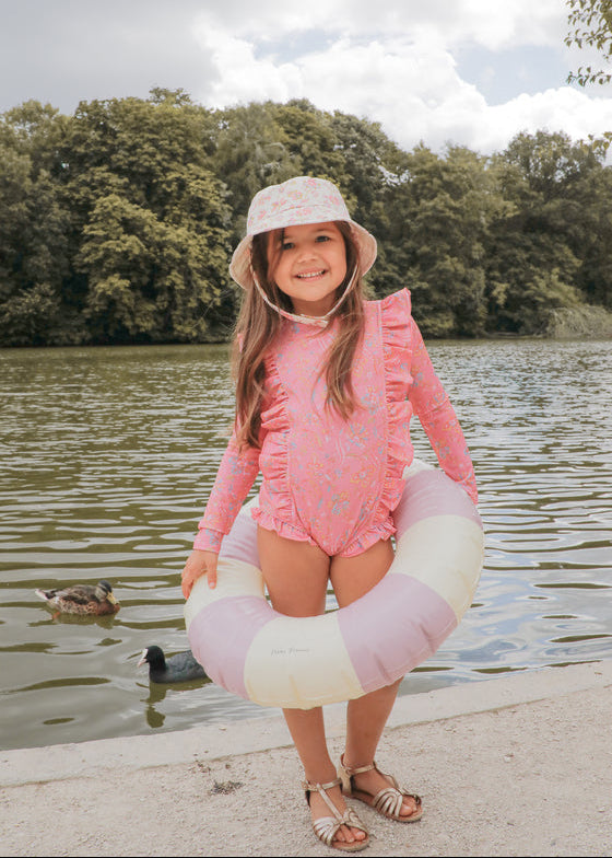 Louise Misha Aurelia girls long sleeve UV swimsuit in Pink Mallow Romance — UPF 50+ recycled fabric, front view