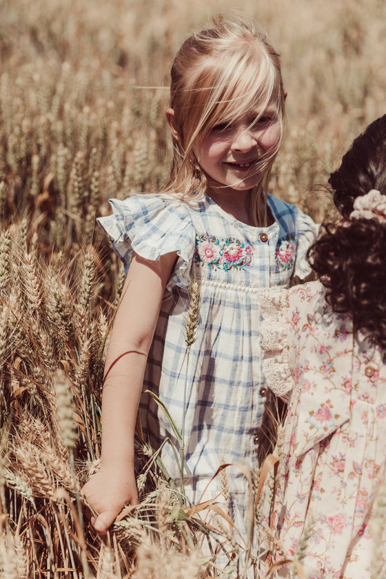 Girl summer dress - Caroline in blue river checkered pattern made from high-quality lightweight organic cotton by Louise Misha. Shop girls summer clothing.