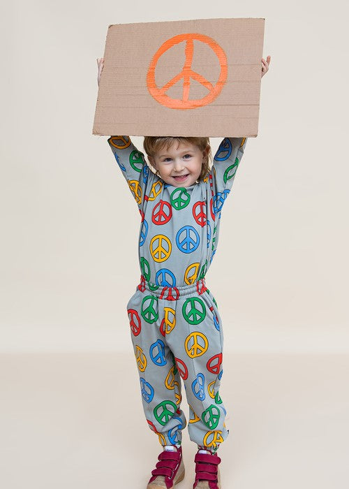 Child wearing CarlijnQ organic cotton Peace sweater with matching joggers