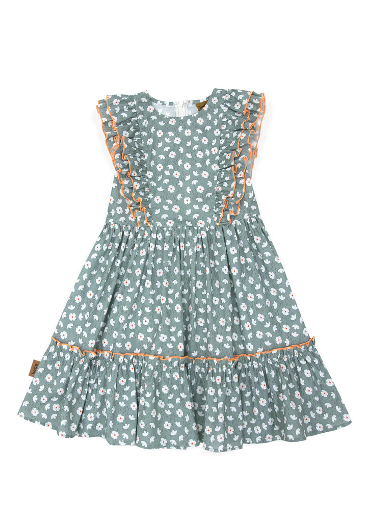 This girl's dress features a beautiful green flower print that is both vibrant and eye-catching. The dress is adorned with delicate trills in an orange finish, adding a touch of whimsy to the overall design. Mini Me dresses and Mommy and Me dresses are available, the best present for mothers day - shop girls dresses.
