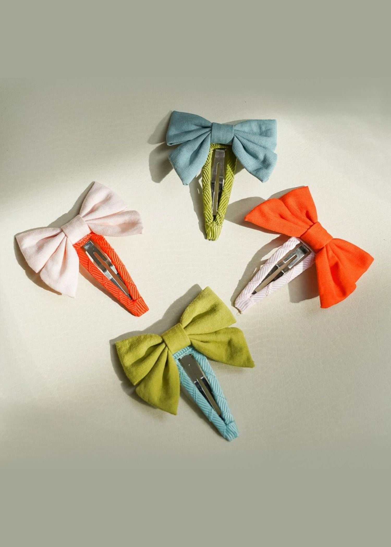 Grech & Co organic cotton bow hair clip sets in multiple colours including blue, green, orange and blush — sustainable girls hair accessories