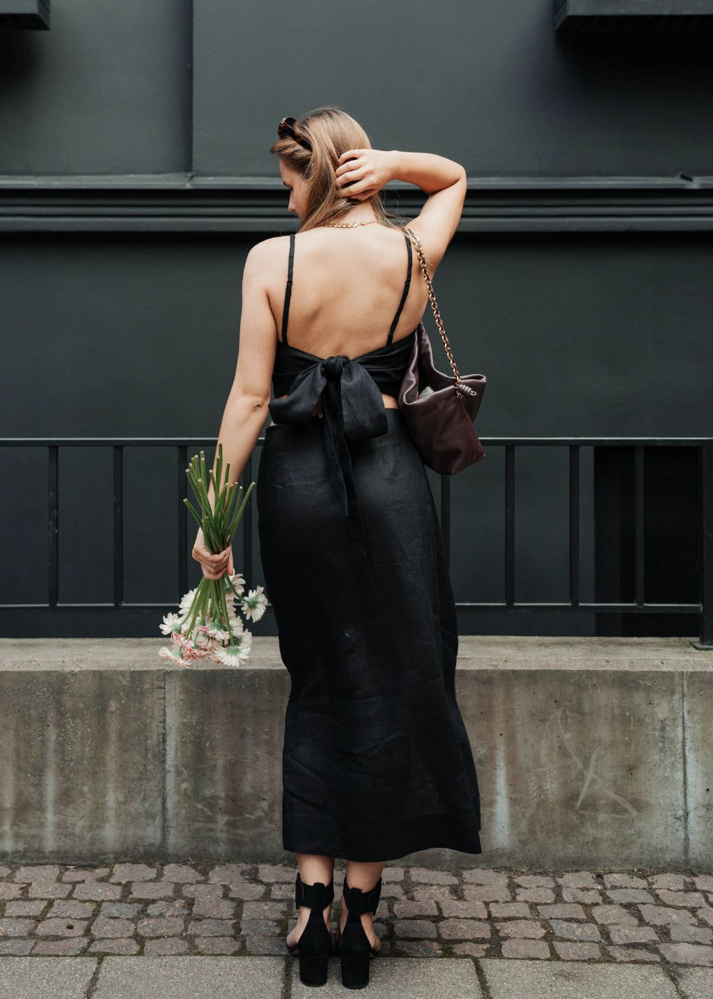 Black linen midi skirt styled as a set with matching crop top — sustainable deadstock fashion by MiliMilu