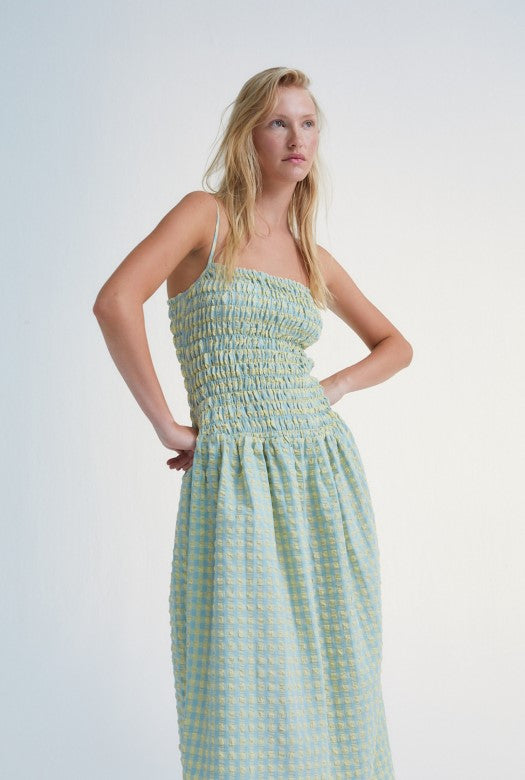 Canyon women summer maxi dress from cotton. The checkeredd women summer dress is designed with straps, pockets, and smock top. The most stylish summer dress.
