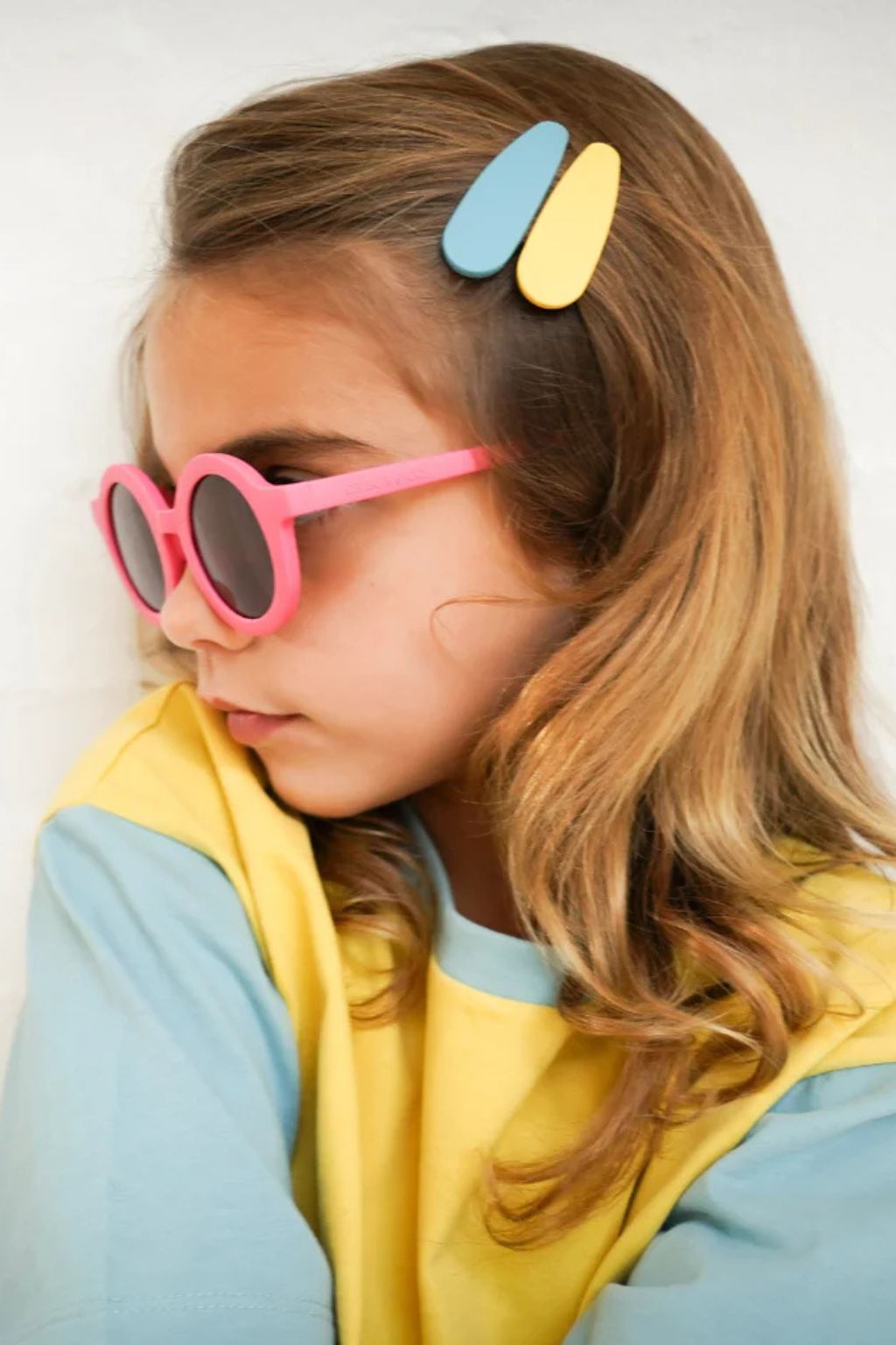 Sustainable kids sunglasses in bright pink by Grech & Co are made from eco-friendly break-resistant material - offering higher durability & longevity.
