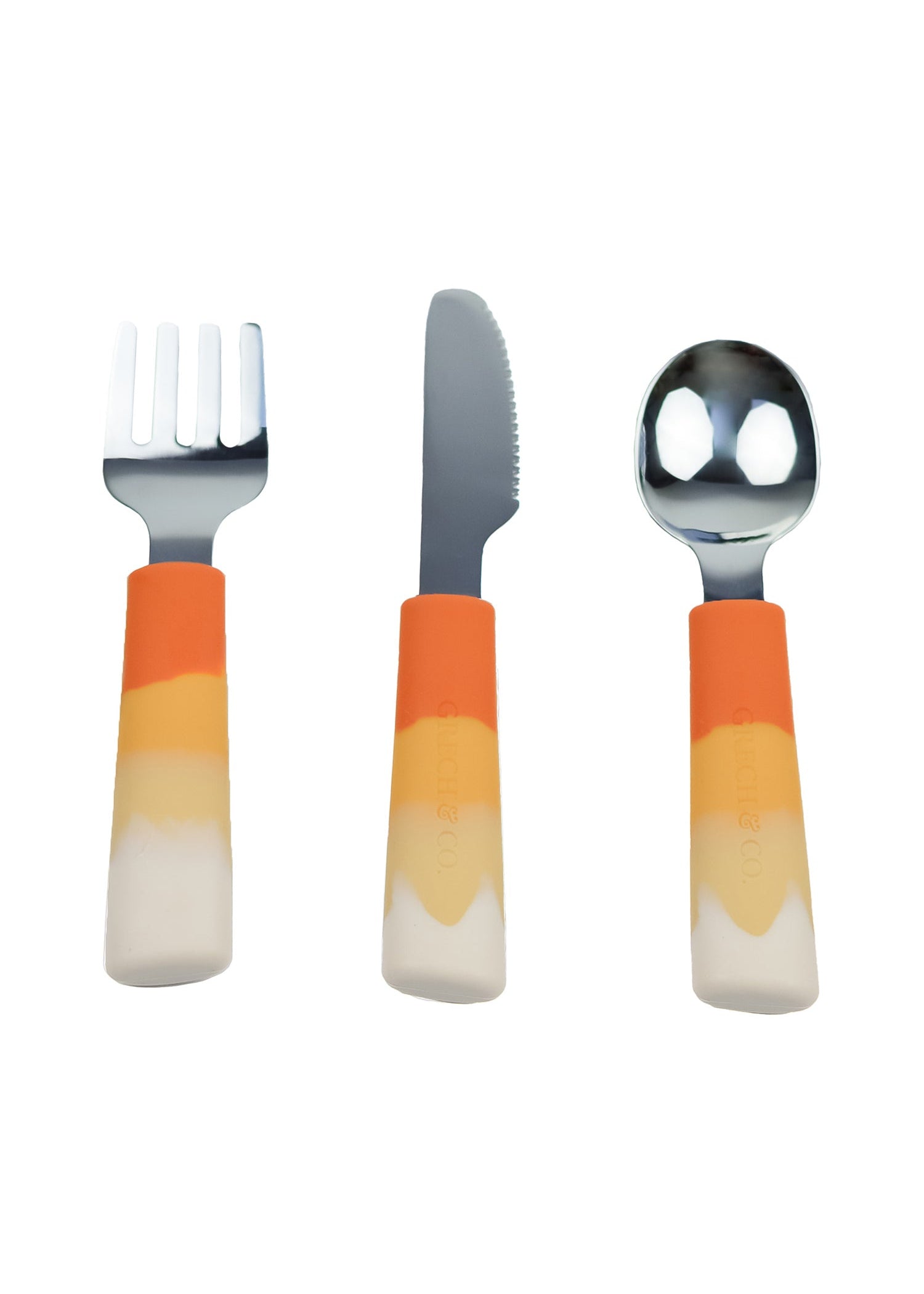 Grech & Co 3-piece kids cutlery set in Sienna Ombre orange — fork, knife and spoon with cream yellow amber terracotta silicone handles and stainless steel heads on white background at Milimilu