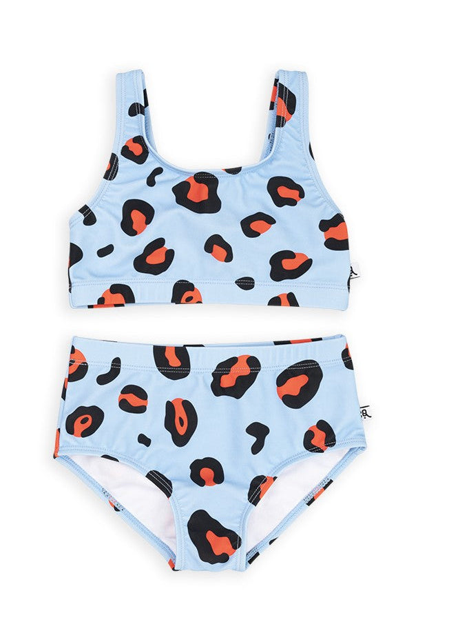 Tween girl in leopard bikini at beach - eco-friendly swimwear for ages 1-14 years