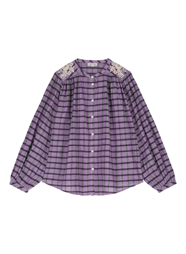 The most loved women's blouse, Jeanne it, beams with its purple checks made of yarn-dyed fabric adorned with embroideries and with the most beautiful details by Louise Misha. Mini Me matching with boy and girl is available. Shop this stunning women's blouse online in Hong Kong and Singapore at MiliMilu.