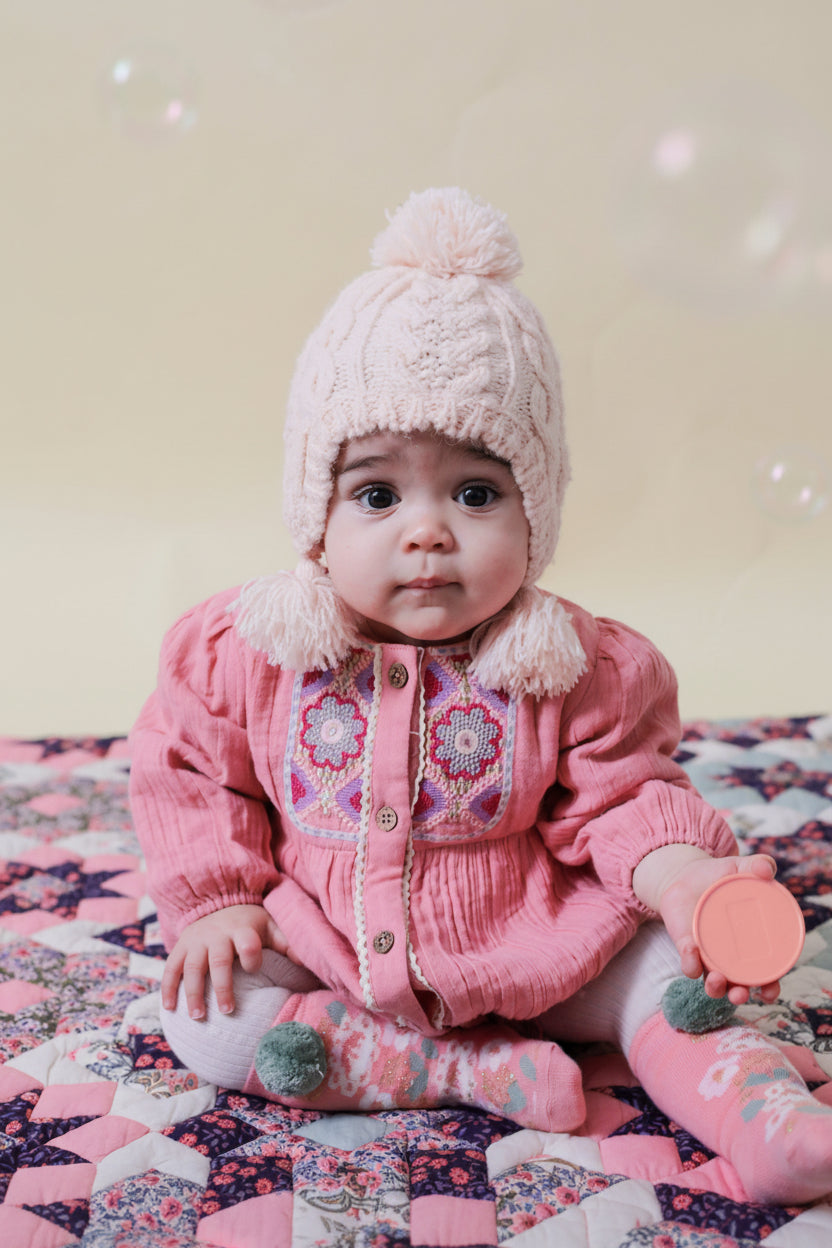 Front view Liliana baby romper pink - breathable organic muslin with lurex details