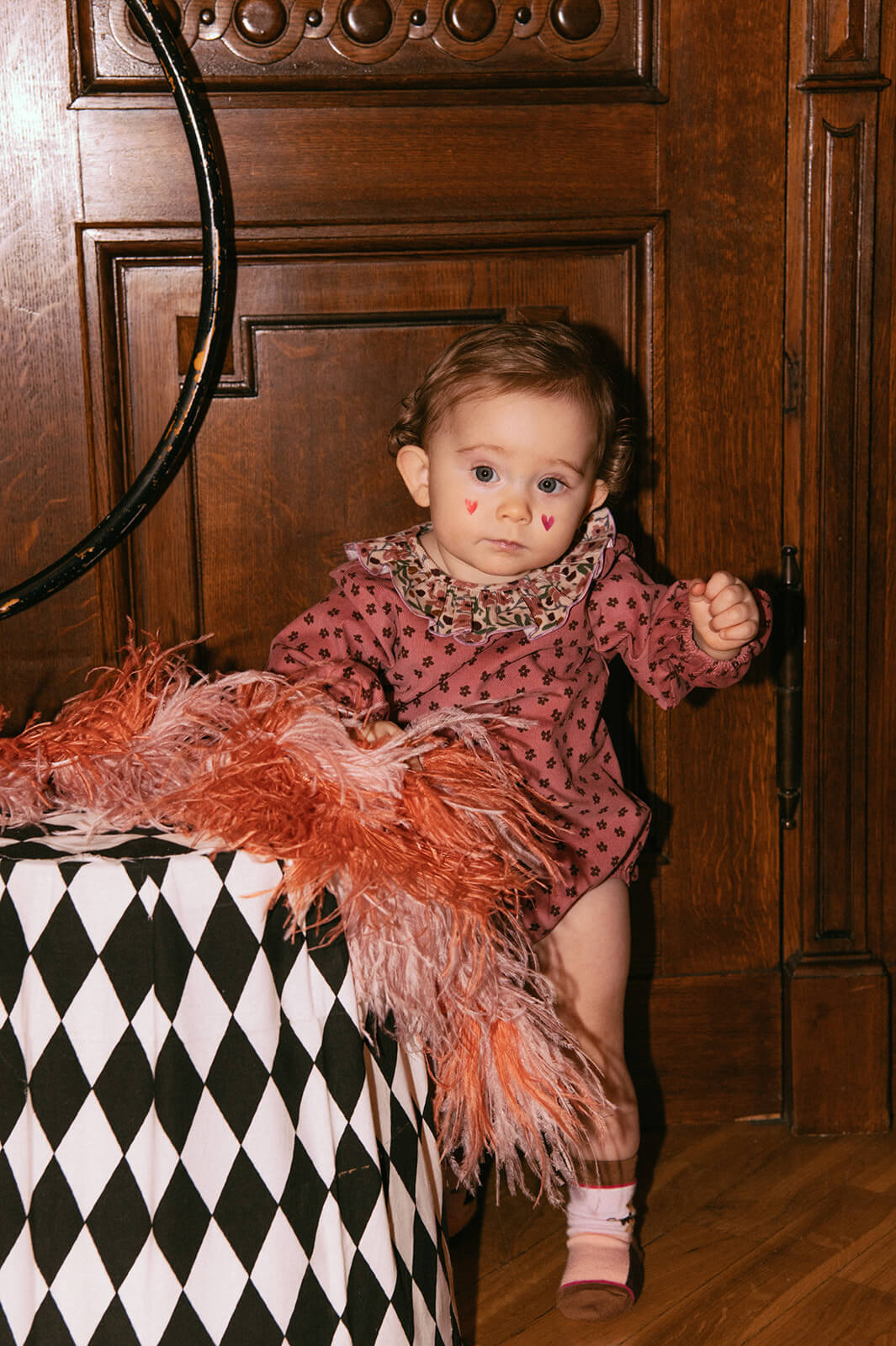 Pink velvet baby romper with a beautiful flower print - the best sustainable baby clothing. The baby girl romper with flowers is made of lightweight velvet.