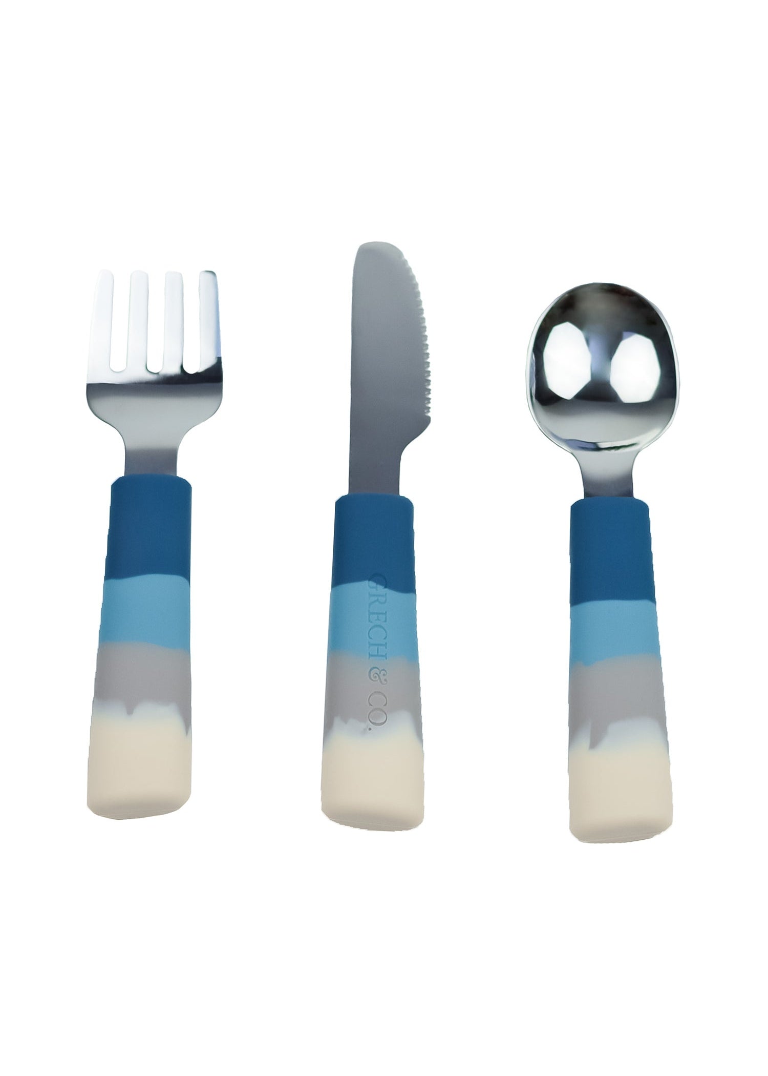 Grech & Co 3-piece kids cutlery set in Ocean Ombre blue — fork, knife and spoon with cream grey sky blue and deep navy silicone handles and stainless steel heads on white background at Milimilu