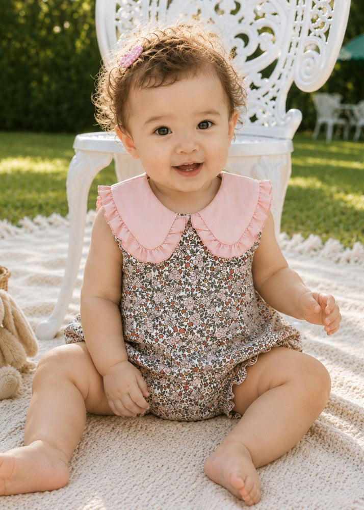 Baby wearing floral print romper with pink Peter Pan collar – organic cotton baby girl romper by Milimilu