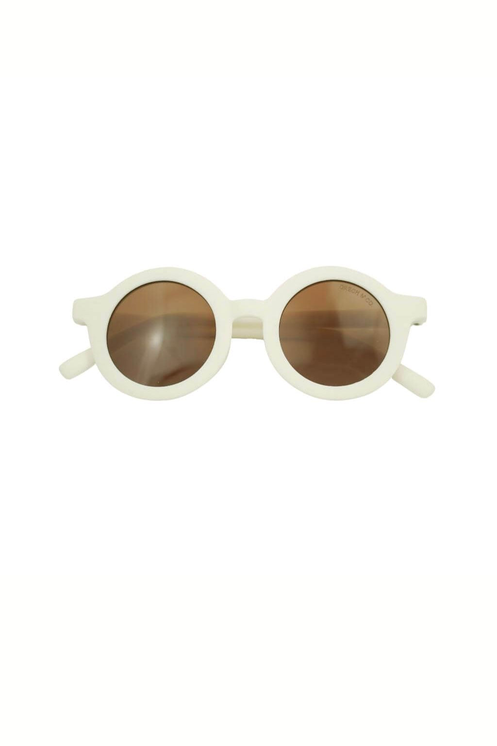 Sustainable kids round sunglasses in white colour by Grech & Co is featured in an eco-friendly/non-toxic break-resistant material at MiliMilu Lifestyle.