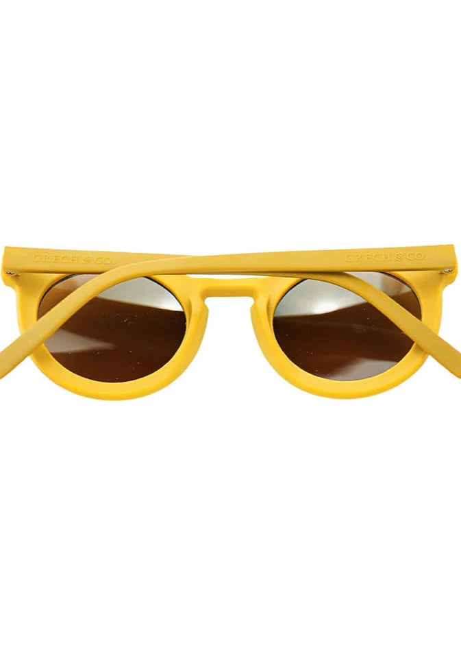 Sustainable kids sunglasses in yellow by Grech & Co with polarised lenses & UV400 protection. MiliMilu offers sunglasses for kids & Mini me matching sunglasses.
