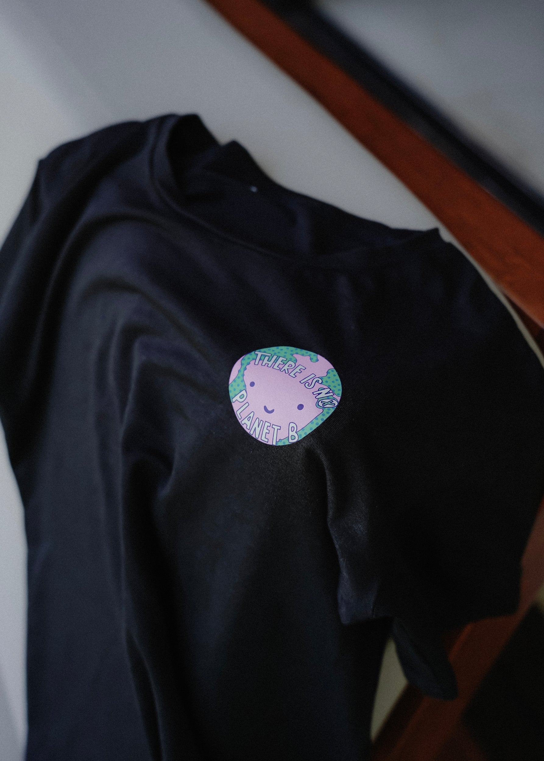 Sustainable black bamboo t-shirt with climate awareness message by MiliMilu