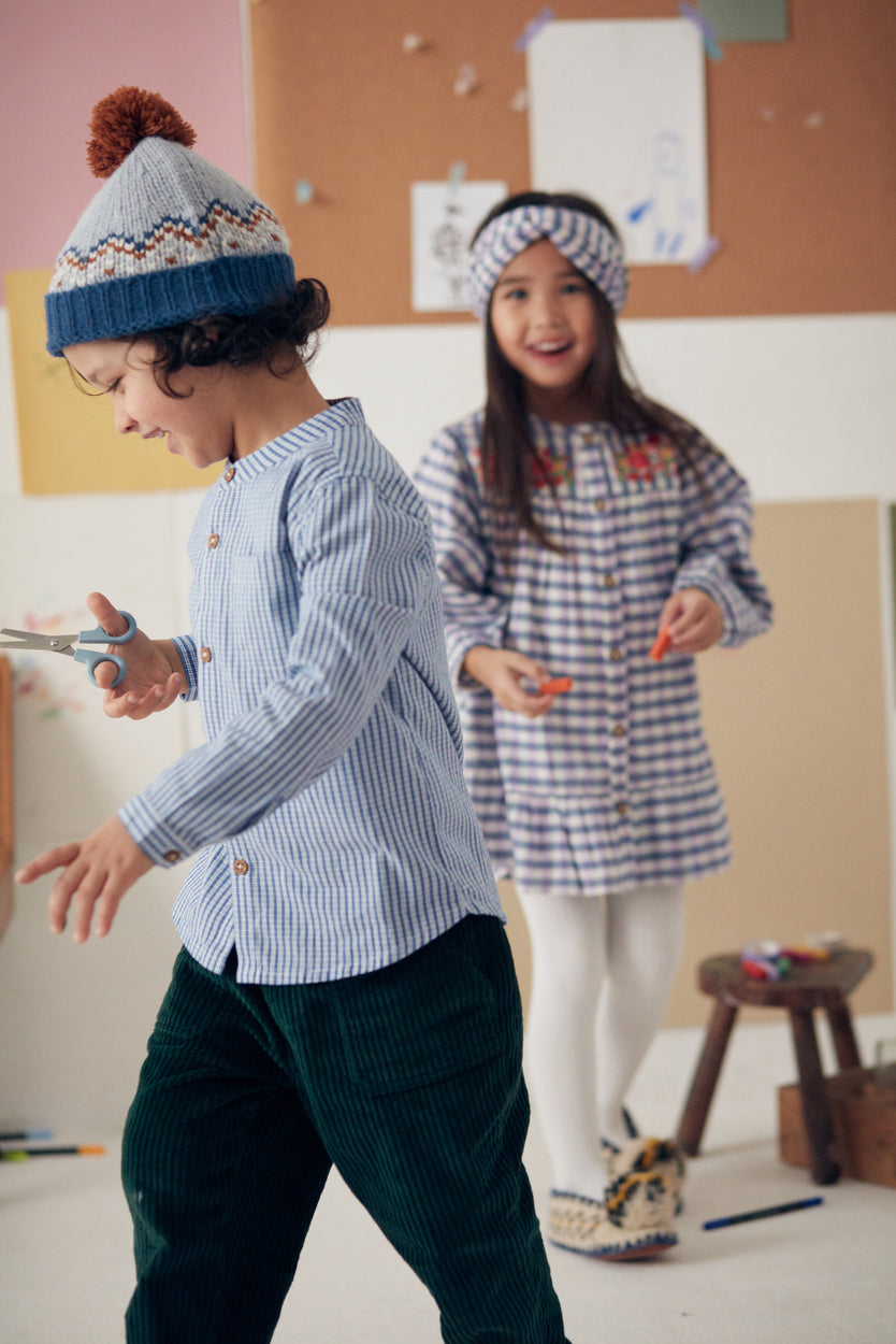 Formal boys shirt with modern twist, this organic cotton boys shirt with blue and white checkers is trendy by Louise Misha sustainable kids clothing online.