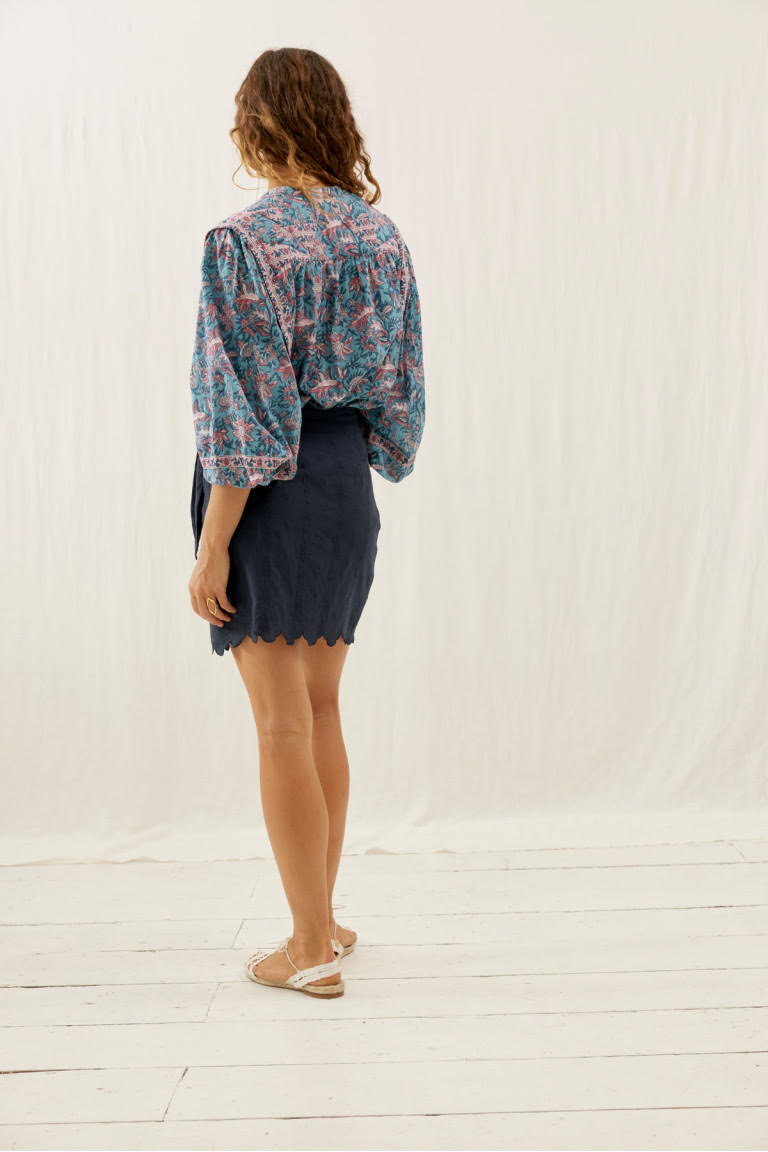 Shop the little black mini skirt Charlie with embroidery fabric and scalloped edges. The black mini skirt are made with breathable cotton by Louise Misha.