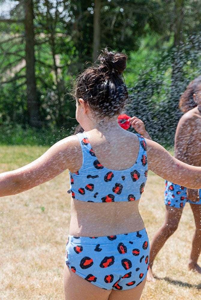 Leopard print girl bikini and tween bikini online. Eco friendly kids bikini, made from recycled materials and with UPF 50. Shop the best kids summer clothing.