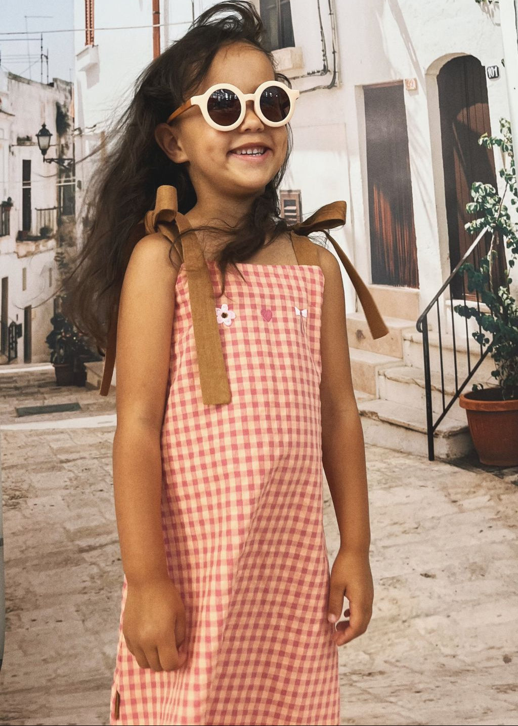 Girls pink plaid dress with adjustable straps by Hebe — sustainable summer kids clothing, perfect for parties and playdates