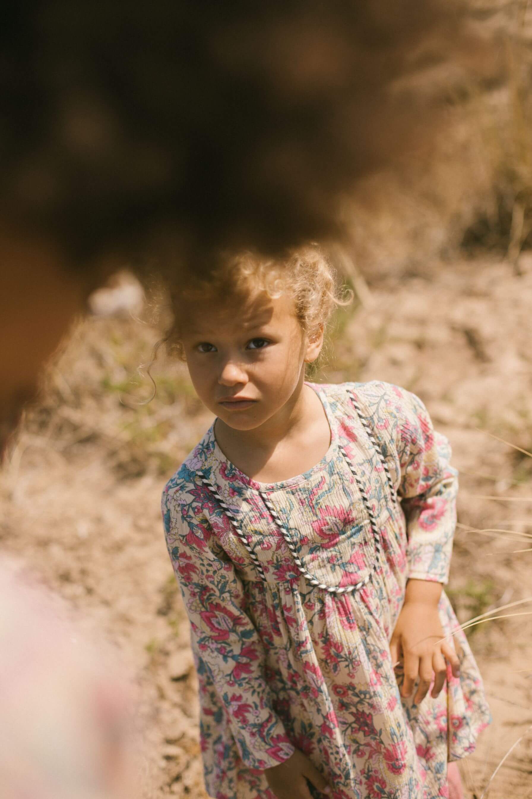 Shop organic cotton girls dresses with bohemian flowers by Louise Misha online in Hong Kong and Singapore. This bohemian-inspired flower girls dress can be worn in summer and winter as it is lightweight and breathable dress. Louise Misha girls dresses on sale, Louise Misha in Hong Kong on sale. Girls muslin dresses.