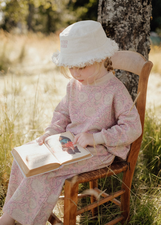Reversible baby sun hat Lajik - pink floral print side showing French-inspired design by Louise Misha