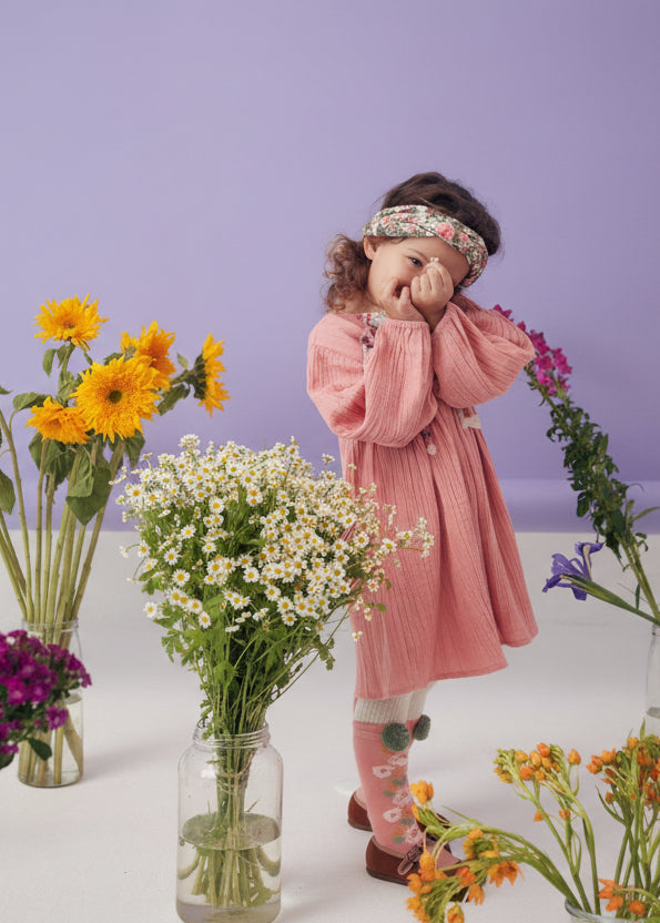 Close-up of Iseena dress embroidery detail - light pink organic cotton artisanal craftsmanship