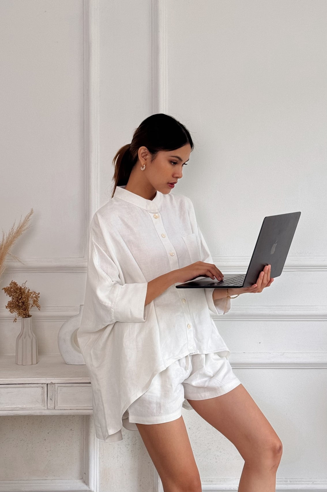 Front view of off-white oversized women's linen shirt - relaxed fit summer top with premium linen construction,