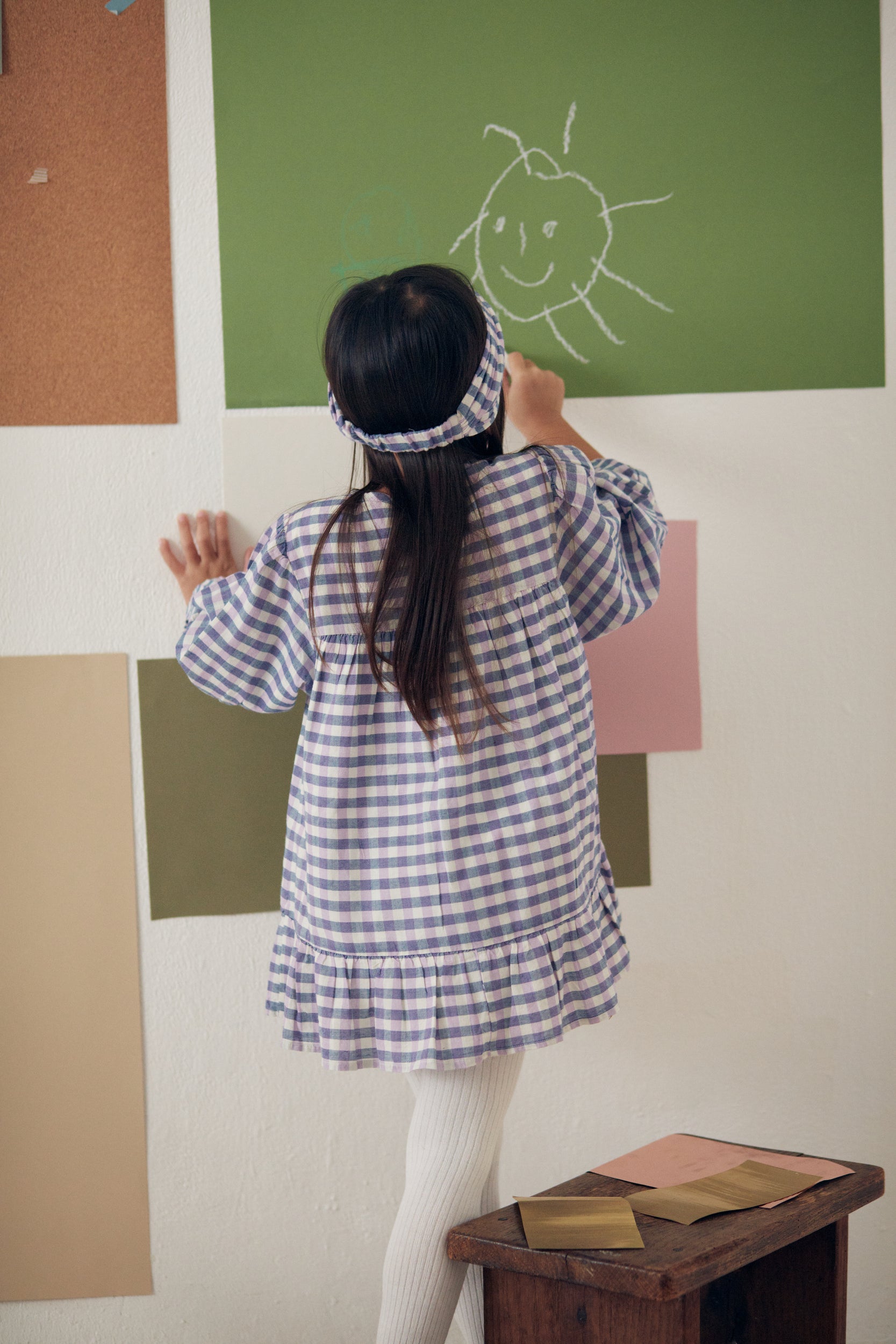 Massilian organic cotton dress is a stunning piece in a soft purple and blue check pattern. Shop the best sustainable kids clothing by Louise Misha at MiliMilu.