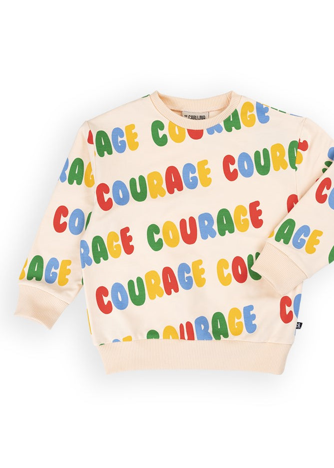 Kids organic cotton sweater with colorful Courage print; detail view