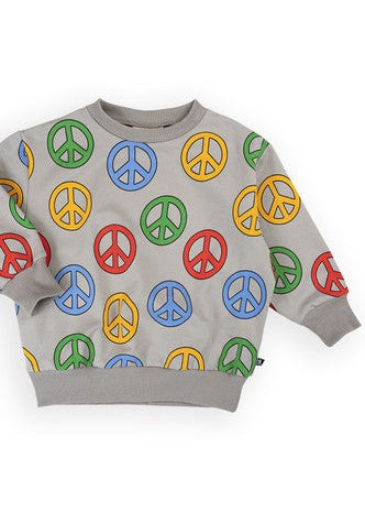 Close-up of Peace design print on kids organic cotton sweater