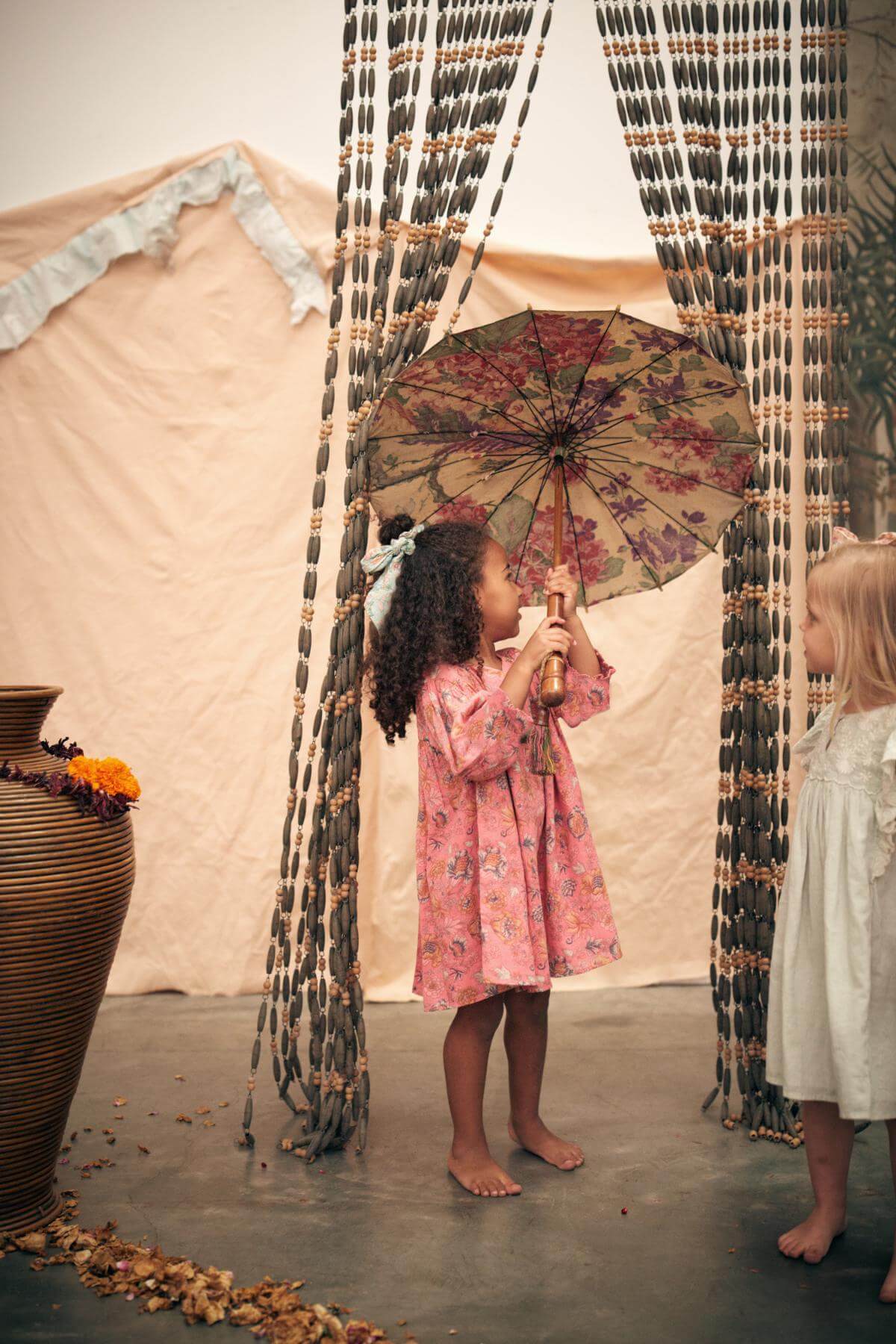 Pink organic cotton girl dress is a perfect summer dress that is flowy, breathable, and lightweight made with organic cotton by Louise Misha. Best girl dress.