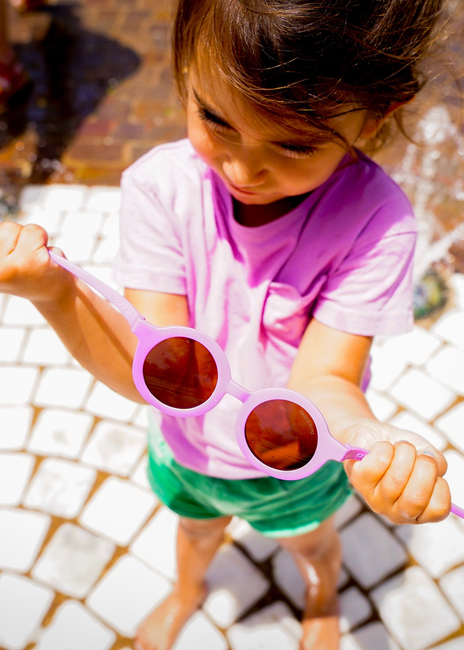 Sustainable kids sunglasses in bright pink by Grech & Co are made from eco-friendly break-resistant material - offering higher durability & longevity.