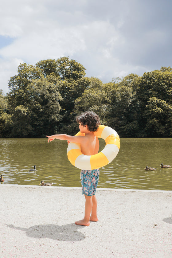 Boy swim trunks in blue, these swim shorts provide SPF 50 sun protection by Louise Misha. Shop best kids sustainable swimwear online and gifts online.