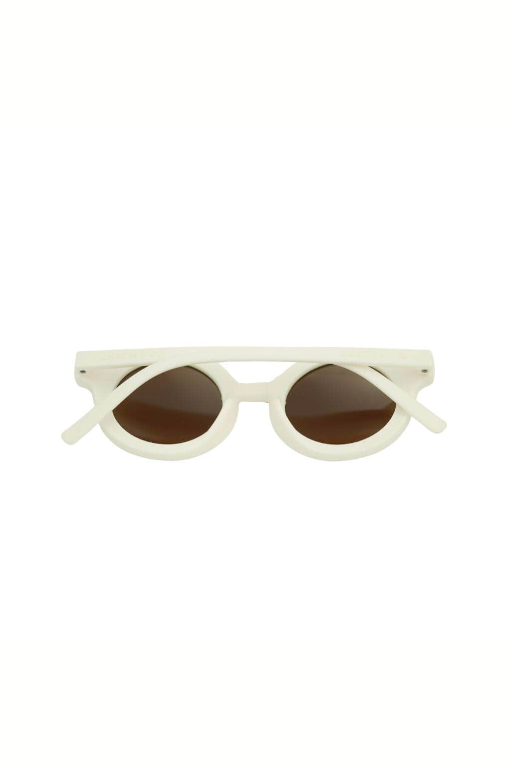 Sustainable kids round sunglasses in white colour by Grech & Co is featured in an eco-friendly/non-toxic break-resistant material at MiliMilu Lifestyle.