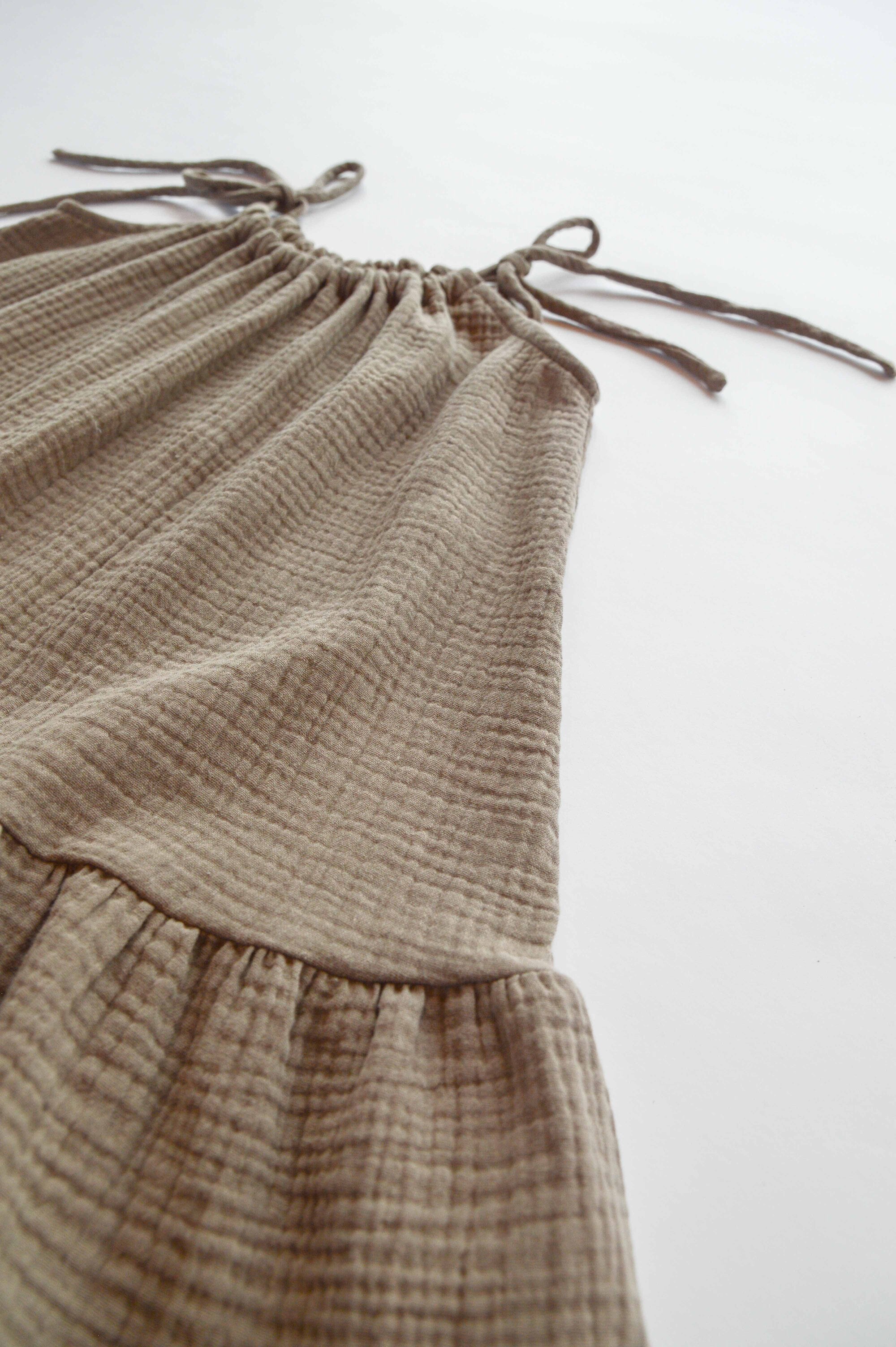 Sustainable girl's dress from lightweight, breathable organic muslin (GOTS) in dusty pink color. Handcrafted with love, made with no nasties, and allergy free. Mommy and me styles are available. Perfect for hot and humid weather and beach holidays.